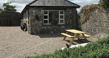 Traditional stone cottage on the river in charming Cashel, Tipperary