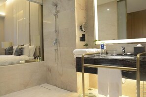 A modern bathroom with a glass-enclosed shower, a marble vanity, and a large mirror. - Days Hotel by Wyndham Chongqing Liangping (Chongqing)