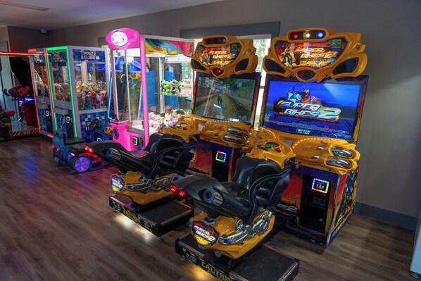 Arcade machines with claw games and racing games. - Sun Outdoors Lake Rudolph (Santa Claus)