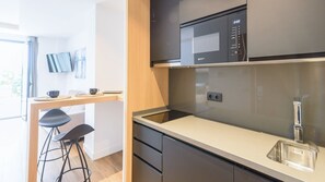 Fridge, microwave, stovetop, coffee/tea maker