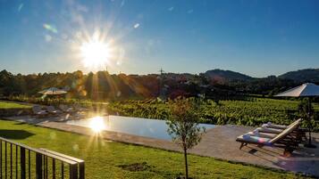 Outdoor pool, open 9:00 AM to 9:00 PM, pool umbrellas, sun loungers