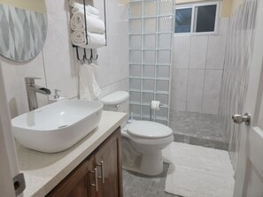 Shower, hair dryer, towels, soap