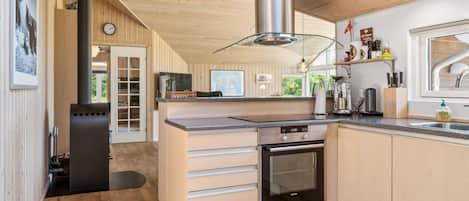 Fridge, stovetop, dishwasher, coffee/tea maker