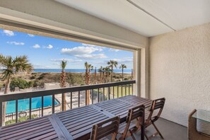 Outdoor dining - Oceanfront condo w 2 pools, private balcony & beach access. Short walk to The Ritz-Carlton (Amelia Island)