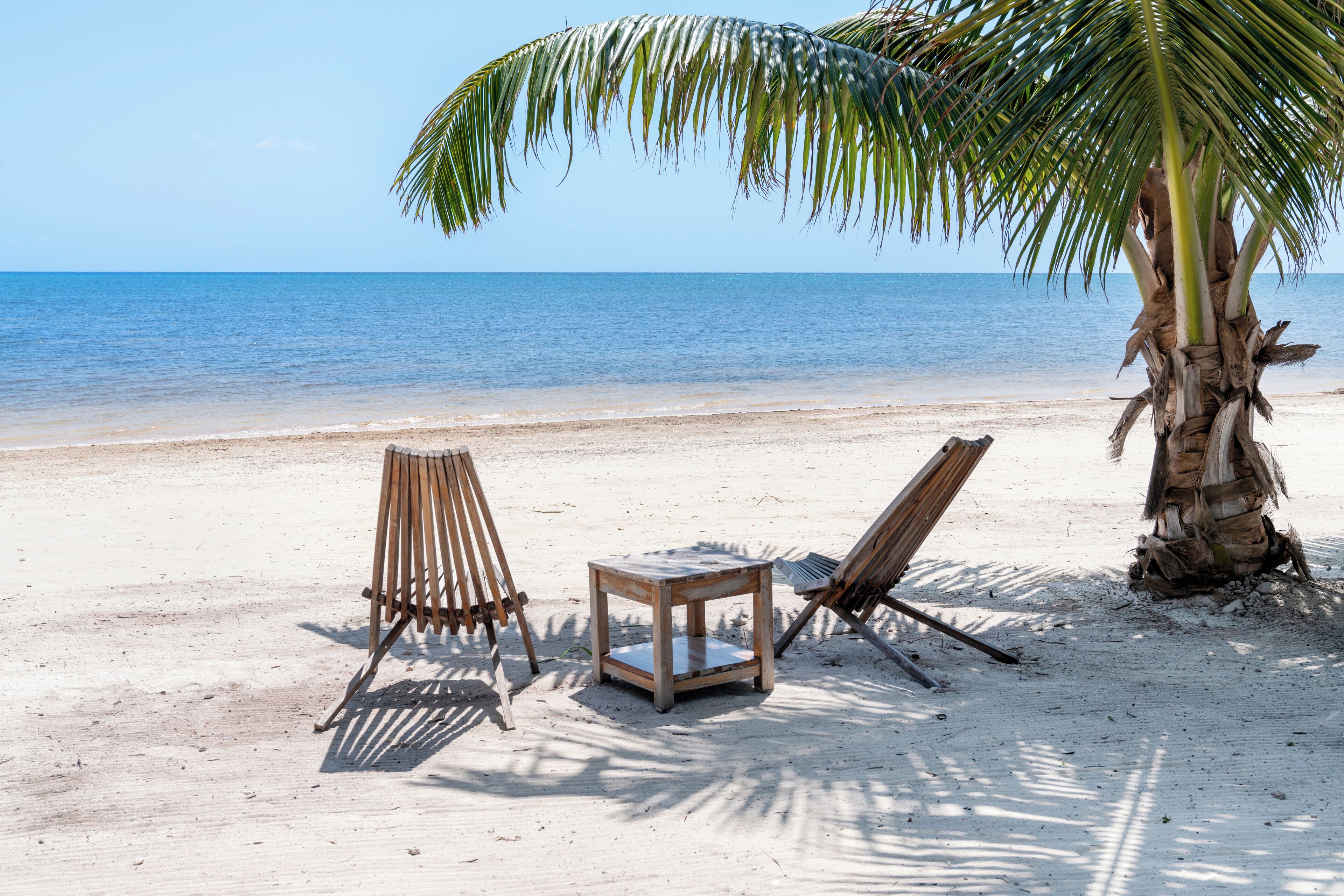 On the beach, white sand, beach towels, beach massages