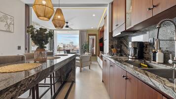 Fridge, microwave, stovetop, coffee/tea maker