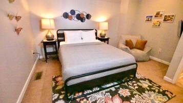 1 bedroom, desk, iron/ironing board, travel crib