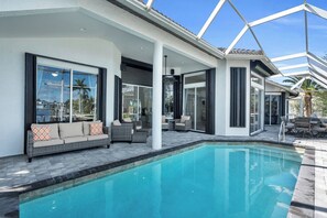 Outdoor pool, a heated pool - Spacious waterfront Oasis with heated pool. (Marco Island)