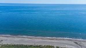 A beach with clear blue water and a sandy shore. - Marinsa Beach,3 bed penthouse (Llanos, Los (Torrox-Costa))