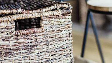 A wicker basket on a wooden table.