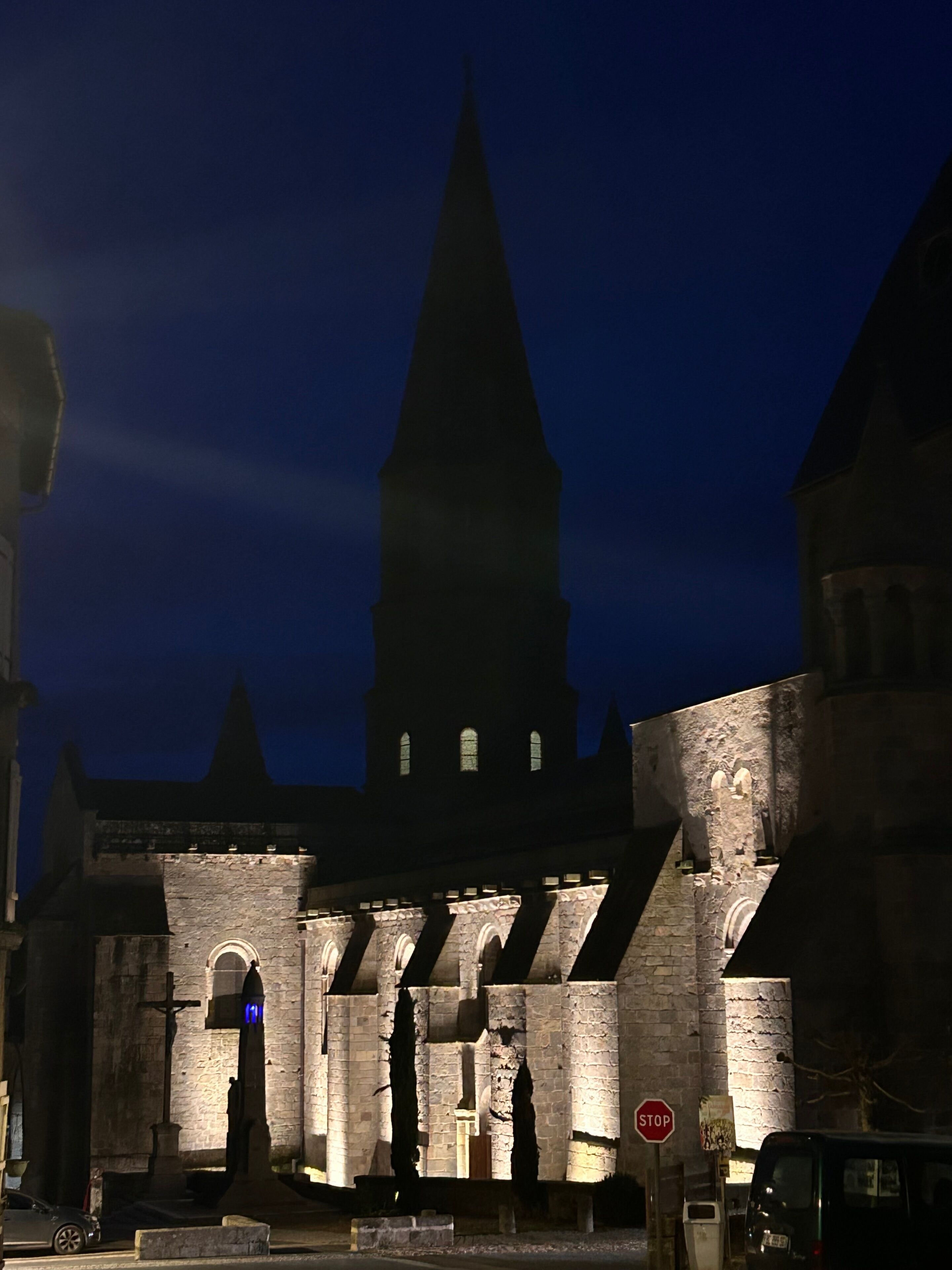 A historic building with a prominent tower and arched windows.