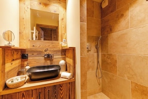 Shower, hair dryer, soap, toilet paper