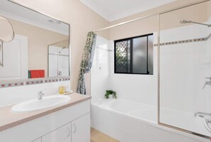 Shower, hair dryer, towels, shampoo