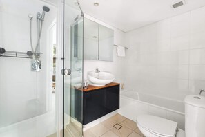 Shower, hair dryer, towels, shampoo