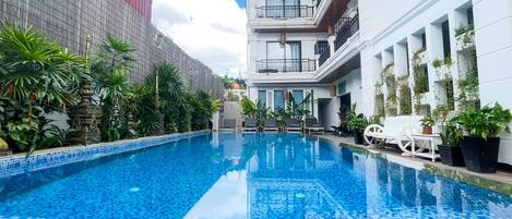 Outdoor pool, open 9:00 AM to 9:00 PM, free cabanas, pool umbrellas