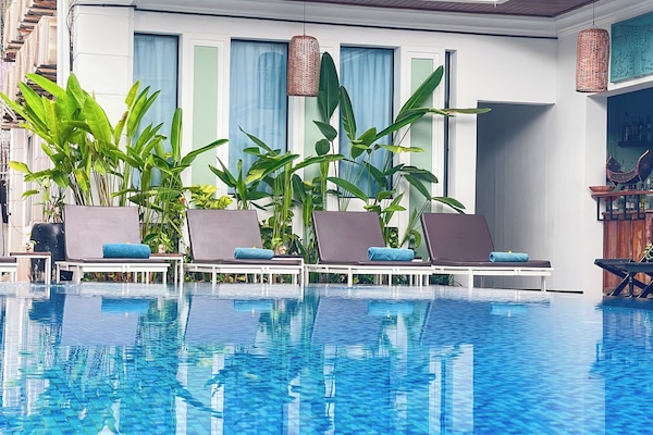 Outdoor pool, open 9:00 AM to 9:00 PM, free cabanas, pool umbrellas