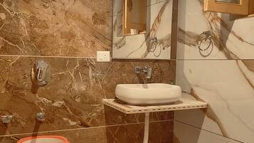 Premium Room | Bathroom | Designer toiletries, hair dryer, slippers, shampoo