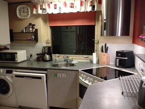 Fridge, microwave, dishwasher, cookware/dishes/utensils