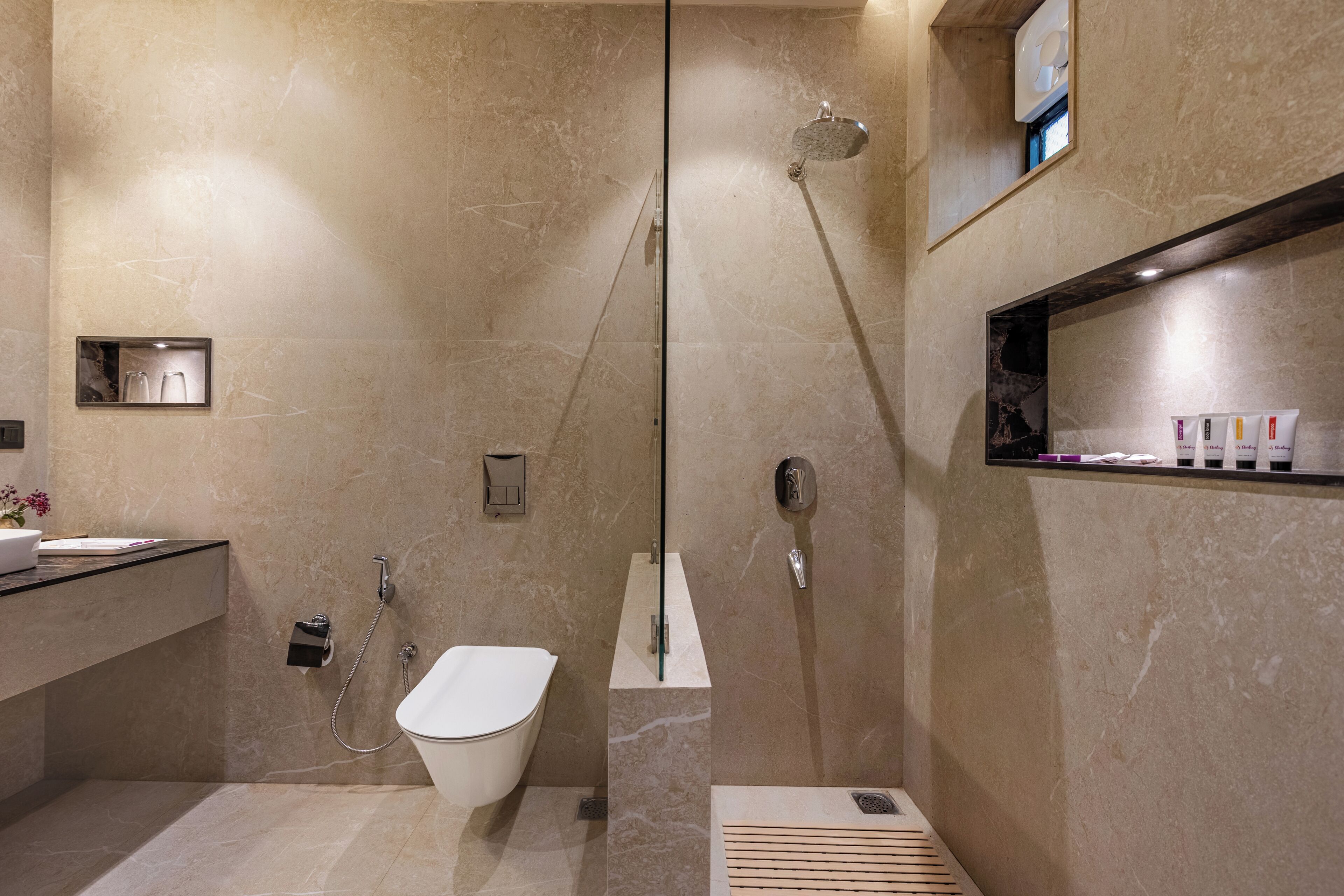 A modern bathroom with a freestanding bathtub, a shower, and a vanity with a mirror.
