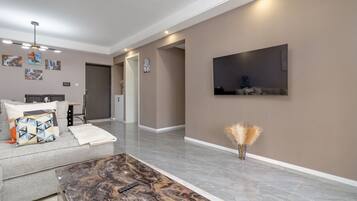 Apartamento executivo, 1 cama King, vista para a cidade | 1 quarto, roupas de cama premium