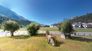 A mountainous landscape with buildings and a clear sky.