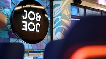 A circular sign with the text 'J&J' in a modern font.