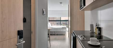 Fridge, microwave, stovetop, coffee/tea maker