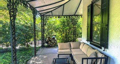 This 4 BR 4 BA sizable home with large outdoor porch & yard is ideal for a family visiting the area.