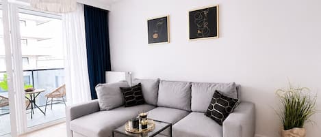 Classic Apartment, Courtyard View | Living area | 40-inch plasma TV with digital channels