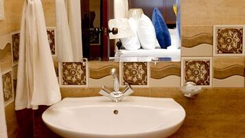 Shower, towels, soap, toilet paper