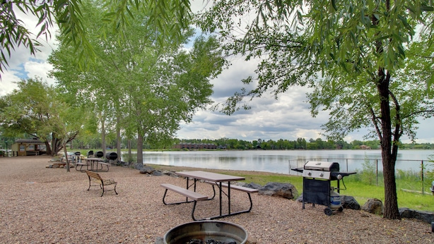 A picnic area with a fire pit, picnic table, and grill by a lake. - 1 Mi to Lake: Pet-friendly Arizona Gem (Lakeside)
