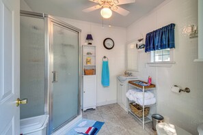 A bathroom with a shower, toilet, sink, and towel rack. - Cayuga Lake , hot Tub, Private Dock (Cayuga)