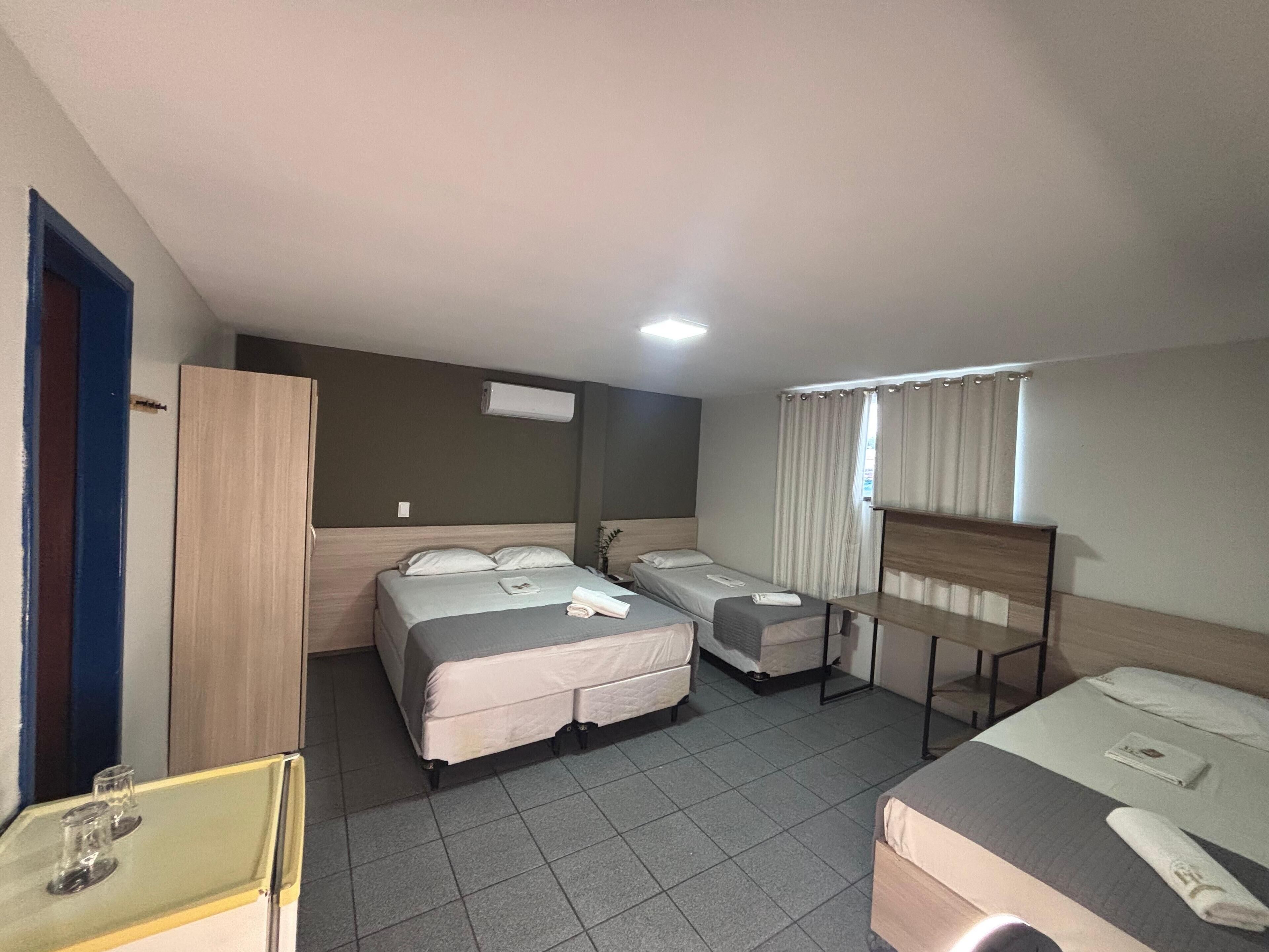 Economy Quadruple Room, 1 Bedroom, Non Smoking, Air conditioning | Minibar, free WiFi, bed sheets