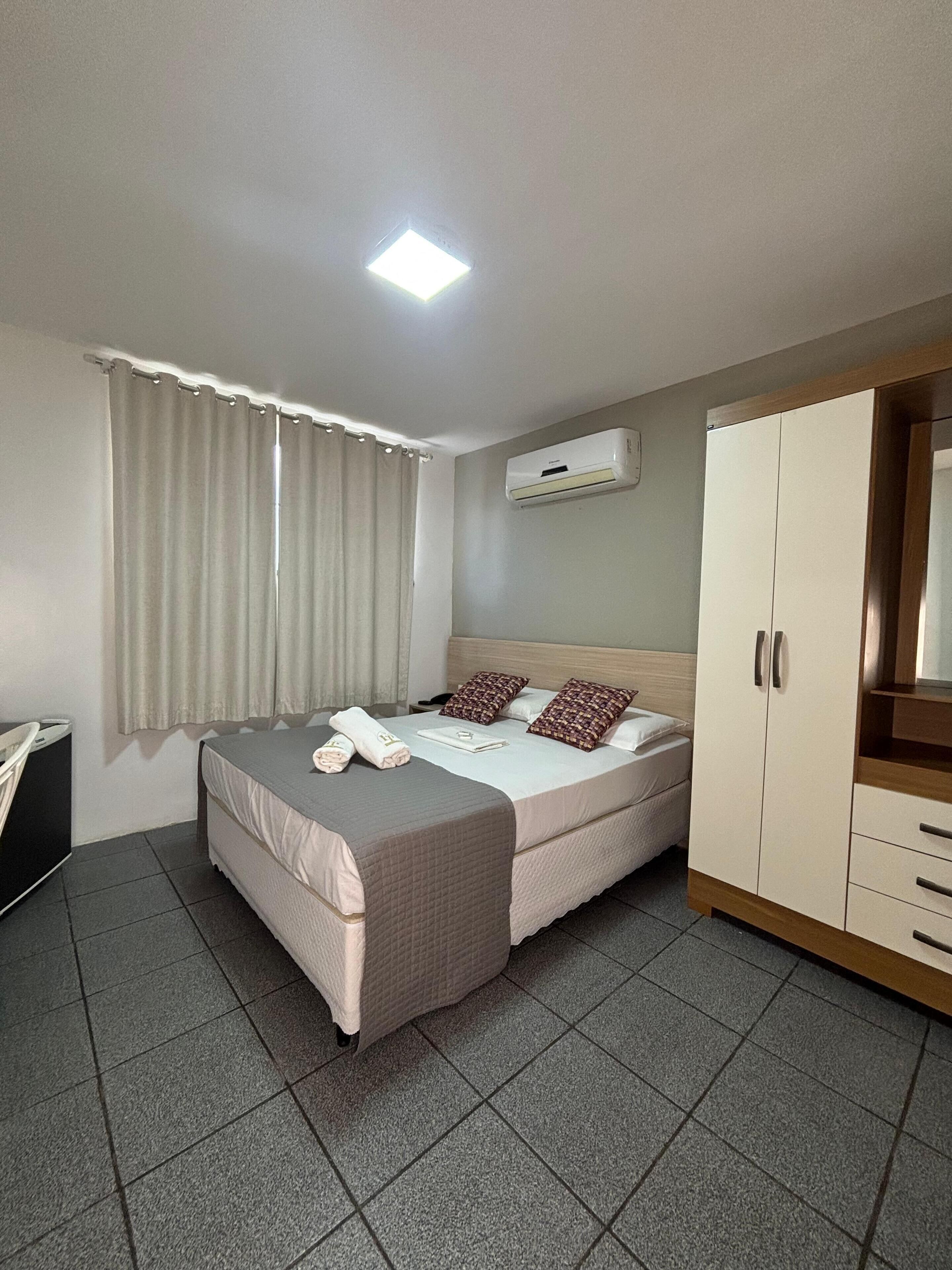 Economy-dobbeltværelse - 1 soveværelse | Badeværelse | Brusehoved med spredningseffekt, håndklæder, Sæbe, Toiletpapir