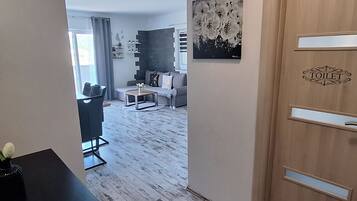 Apartment (One Bedroom Apartment With Sea View) | Living room | 32-inch flat-screen TV with satellite channels