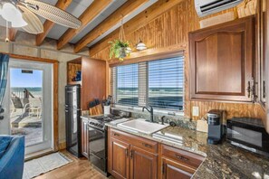 Fridge, coffee/tea maker, cookware/dishes/utensils