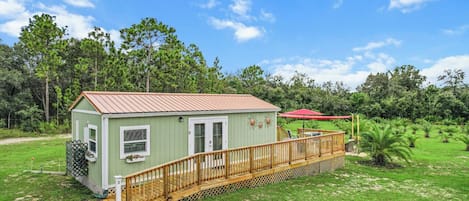 Nestled on 5 acre Palm tree farm all behind a privacy gate to enter. Cabin 3 is the only cabin with a separate patio and hot tub. The surroundings are always peaceful and quiet.