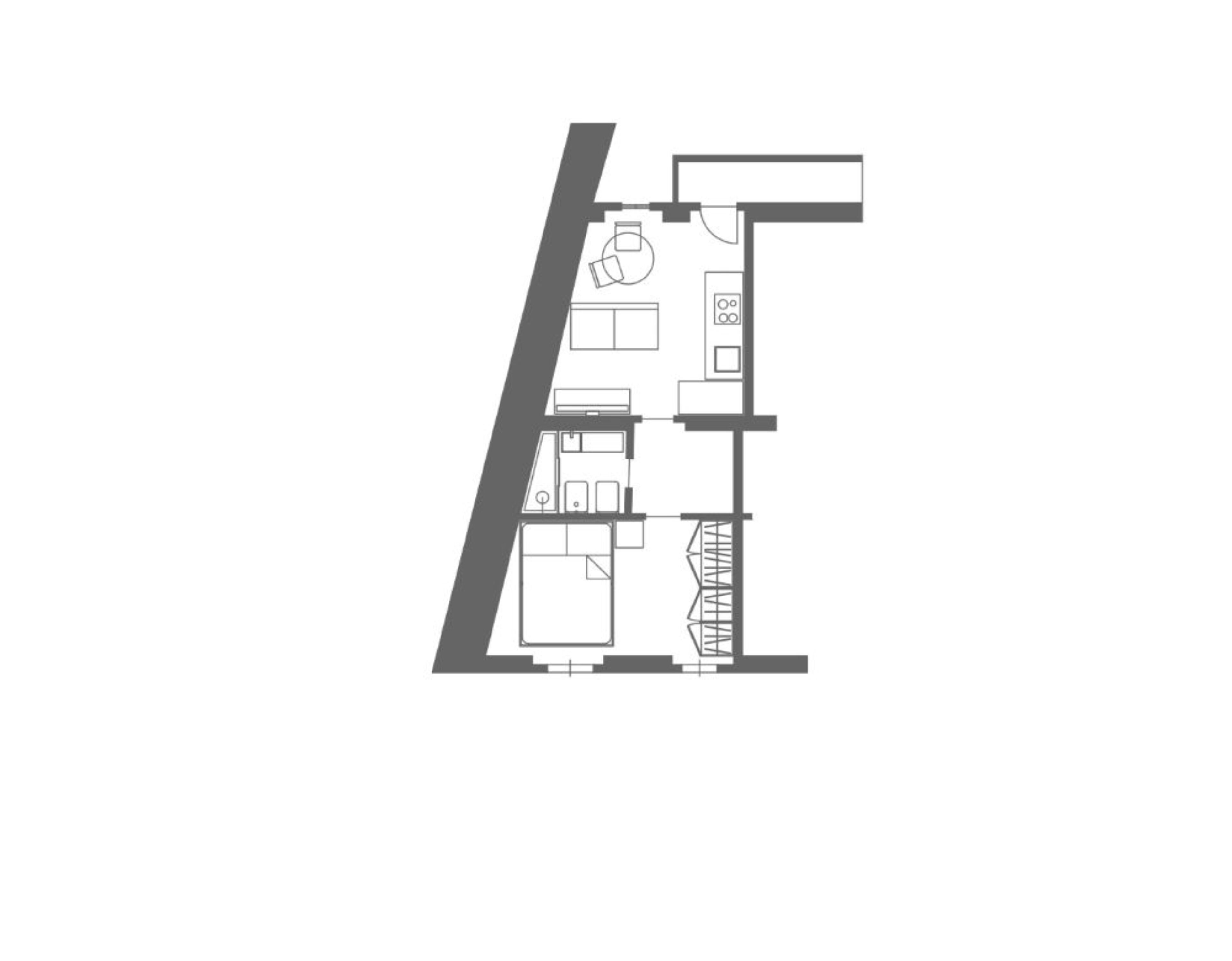 Plano de una habitación de hotel que muestra una cama, un escritorio, una silla, un armario y un baño.