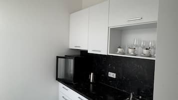Family Apartment | Private kitchen | Electric kettle, highchair