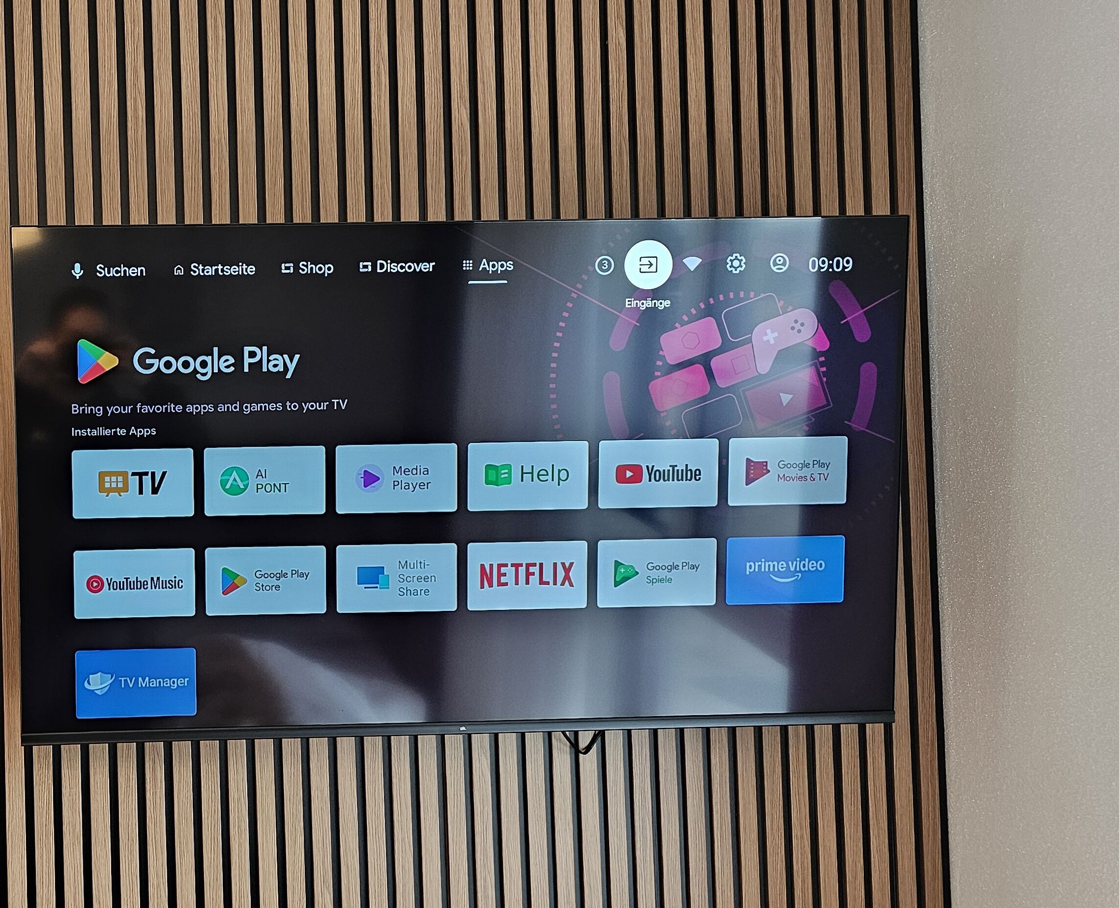 A Google Play screen with various app icons including TV, Netflix, and YouTube.