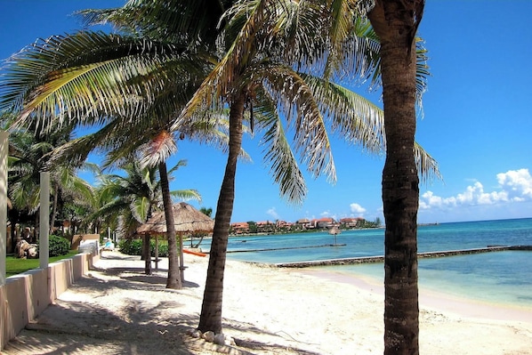 Private beach, white sand, sun-loungers, beach umbrellas