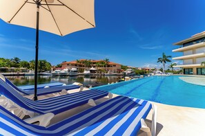 8 outdoor pools, open 7:30 AM to 9:30 PM, pool loungers