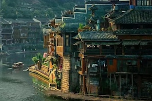A traditional multi-story building with a riverfront location.