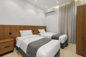 Appartement Familial, 2 chambres, vue partielle sur l'océan | 1 chambre, literie de qualité supérieure