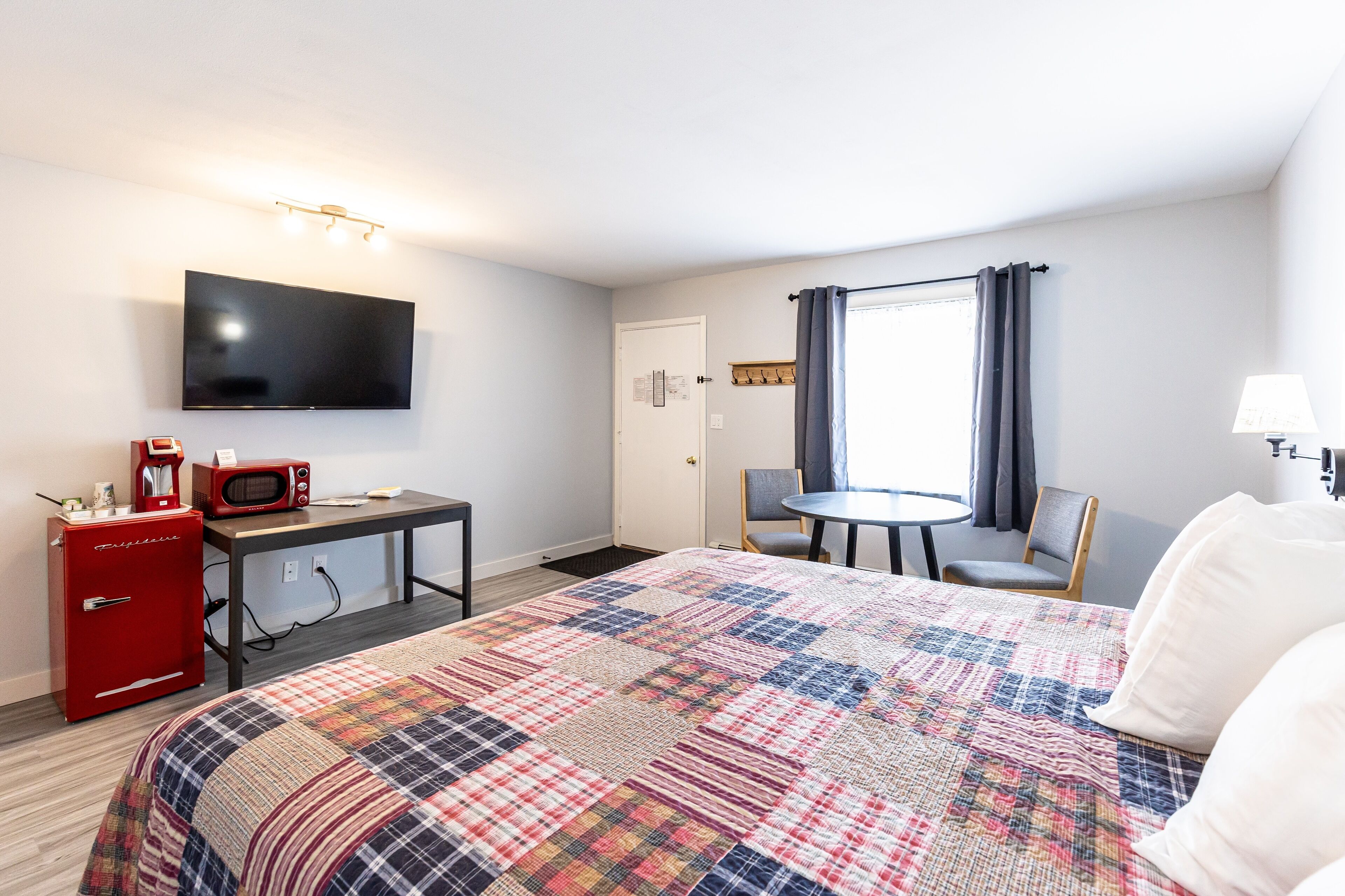 Desk, laptop workspace, blackout curtains, iron/ironing board