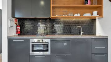 Coffee/tea maker, cookware/dishes/utensils, dining tables