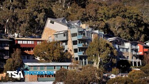 A multi-story building with balconies, surrounded by trees and other buildings. - The Peak 7 - Central Village (Central Village)