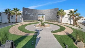 A modern building with a curved facade and the name "Dunada Club" prominently displayed.