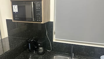 Microwave, stovetop, coffee/tea maker, cookware/dishes/utensils