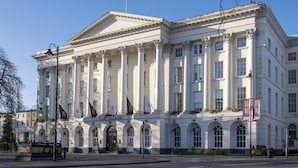A large, classical building with columns and arched windows, labeled "The Queen's Hotel." - Stunning 5 Bed Regency Home (Gloucestershire)